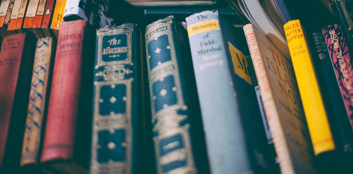 A bunch of books in a row