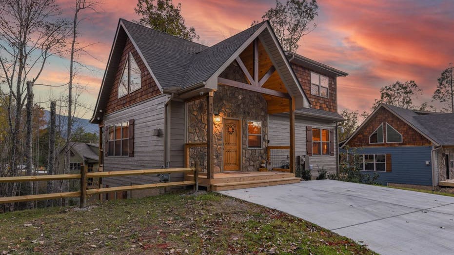 The Moonshine Peak Chalet vacation homeÂ on Vrbo is located in Gatlinburg, Tennessee. This exterior photo shows it's wood and stone cottage.